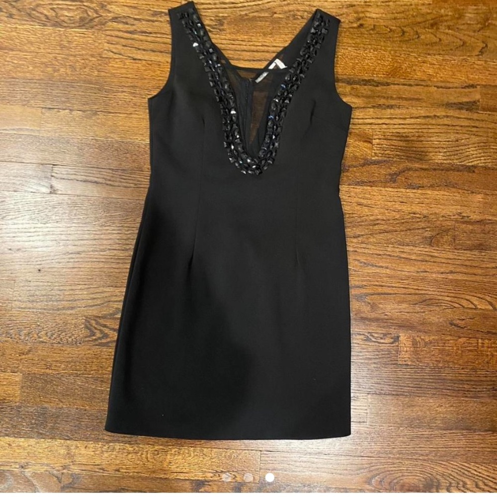 Little black dress with sheer V and bedazzled.